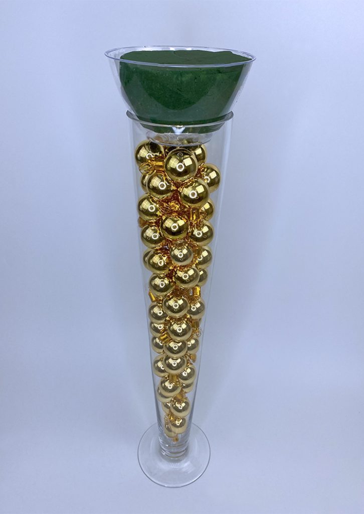 Floral foam on vase filled with beads