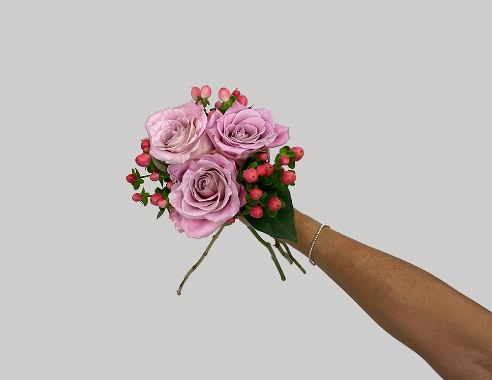 Adding Hypericum to the pink rose bunch