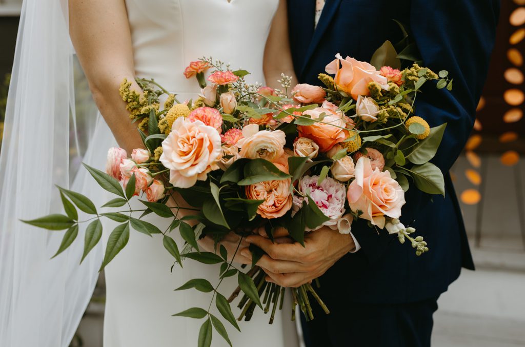 Bride and Groom Holding bouquet