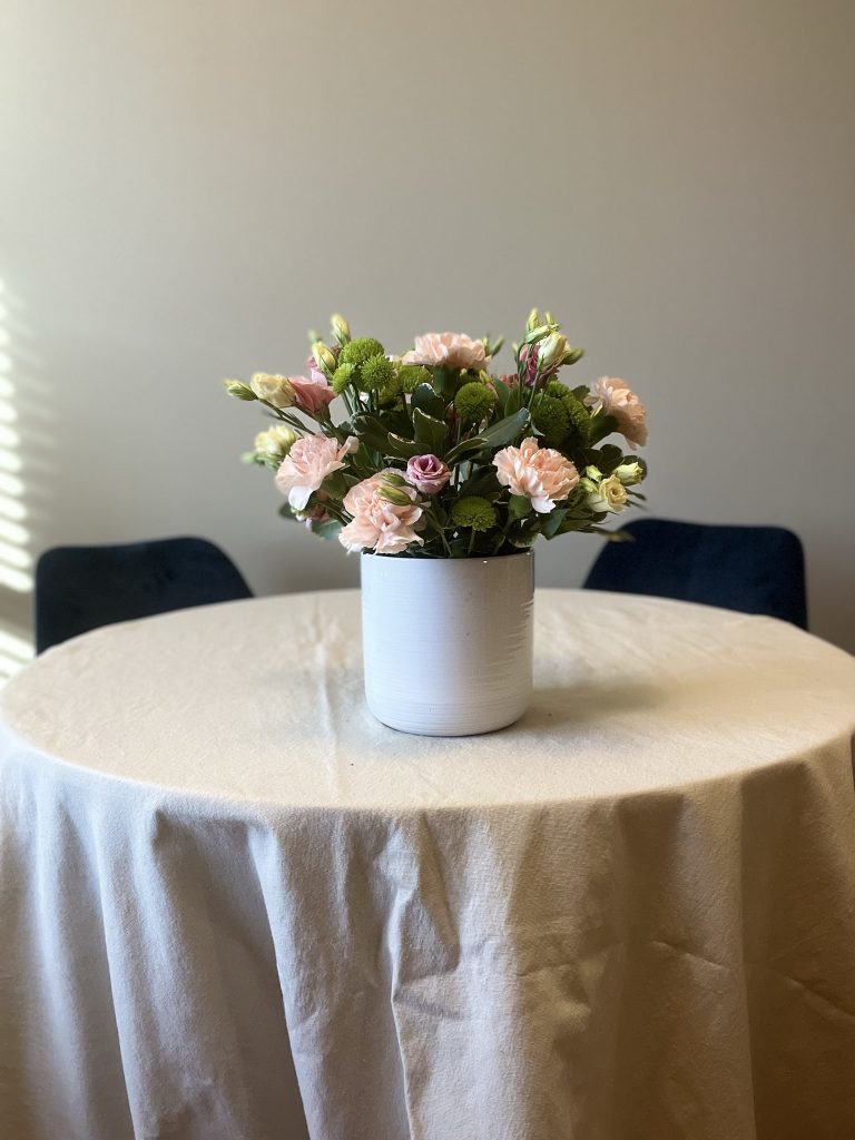 vase with greenery, carnations, lisianthus, and chyrsanthemums