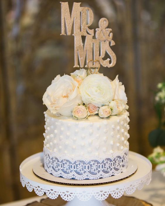 Bouquet of peonies on top of cake