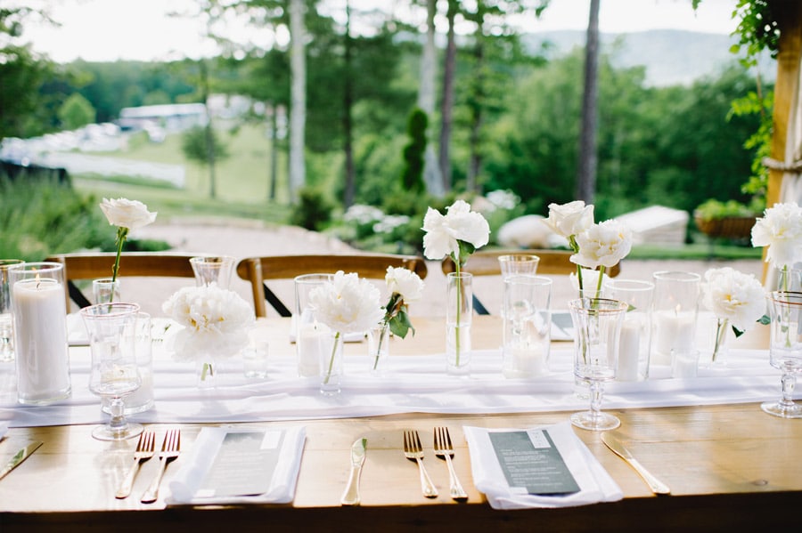 White Linens and Flower Bud Vases Tablesacape for Weddings