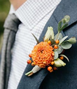 Orange Dahlia & Hypericum Berry Boutonniere