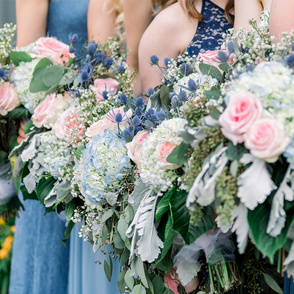 bridal party with pink flowers