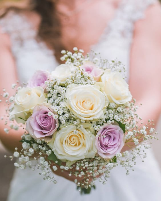 A bouquet of roses and baby's breath