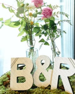 Flowers in large vases with the letters B and R