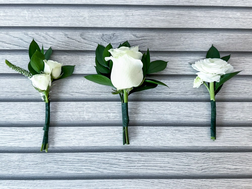 Boutonnieres made with the Classic White Wedding DIY Flower Pack