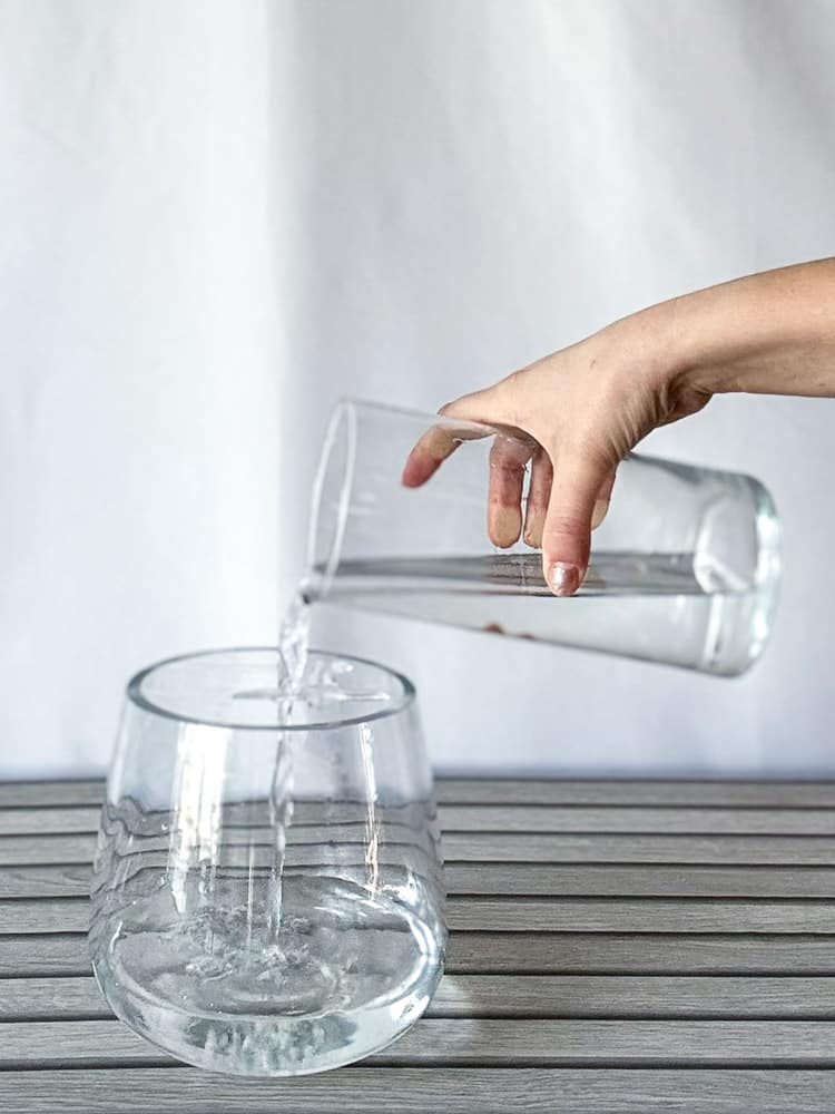 pouring water into a vase