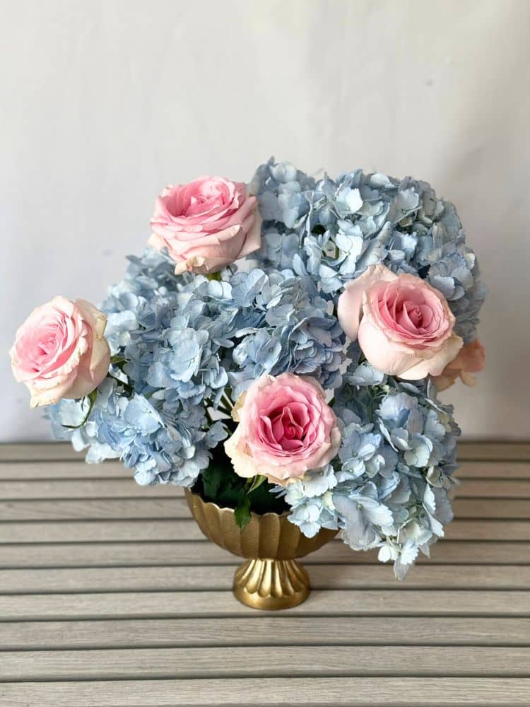 vase with hydrangeas and roses.