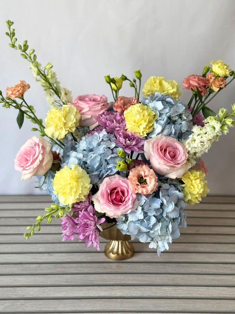 a pastel colored flower arrangement.