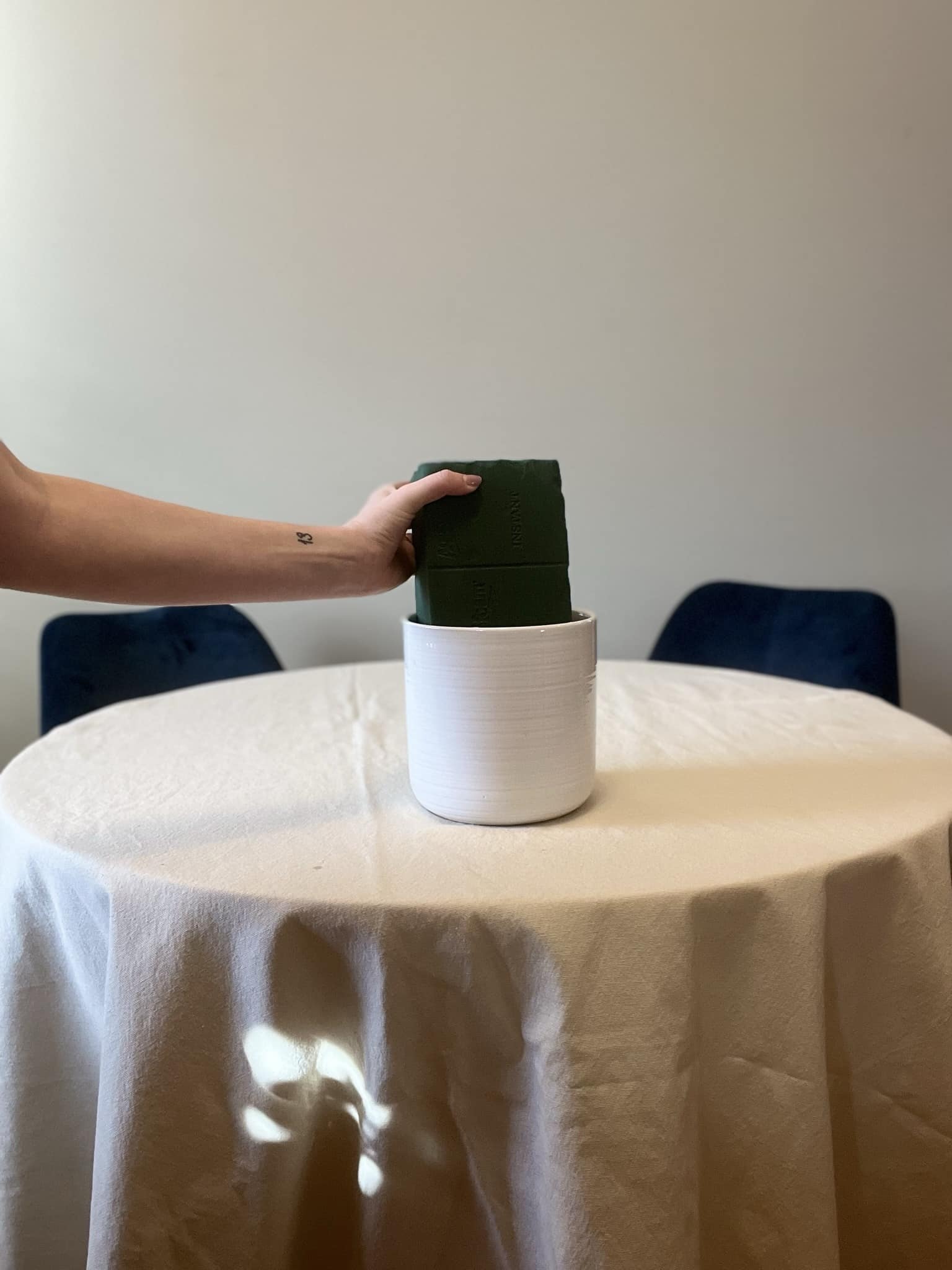 soaking floral foam in a container before using