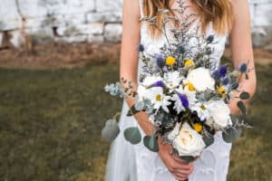 A bride holding a bouquet of flowers.