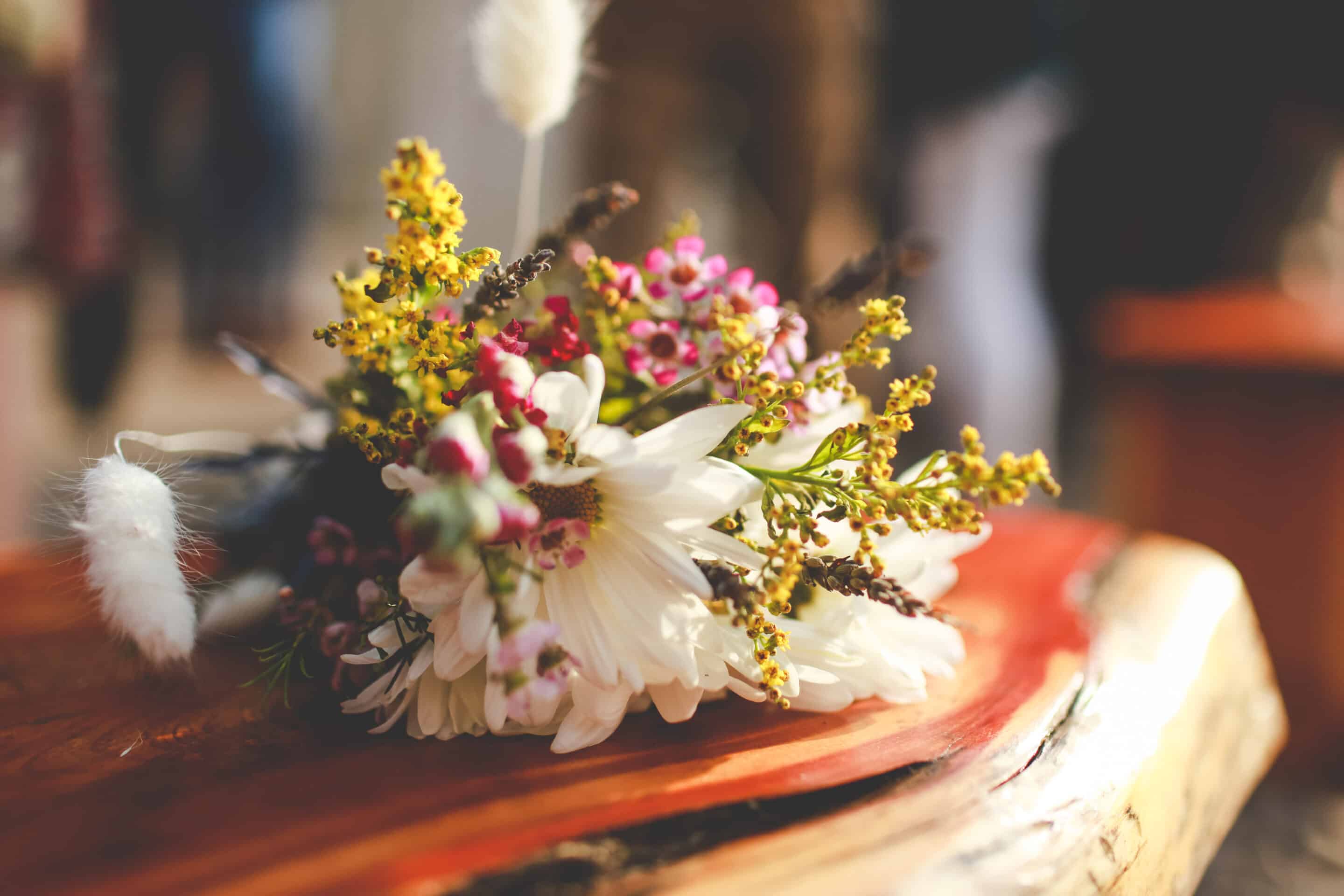 a small bouquet of flowers on a desk