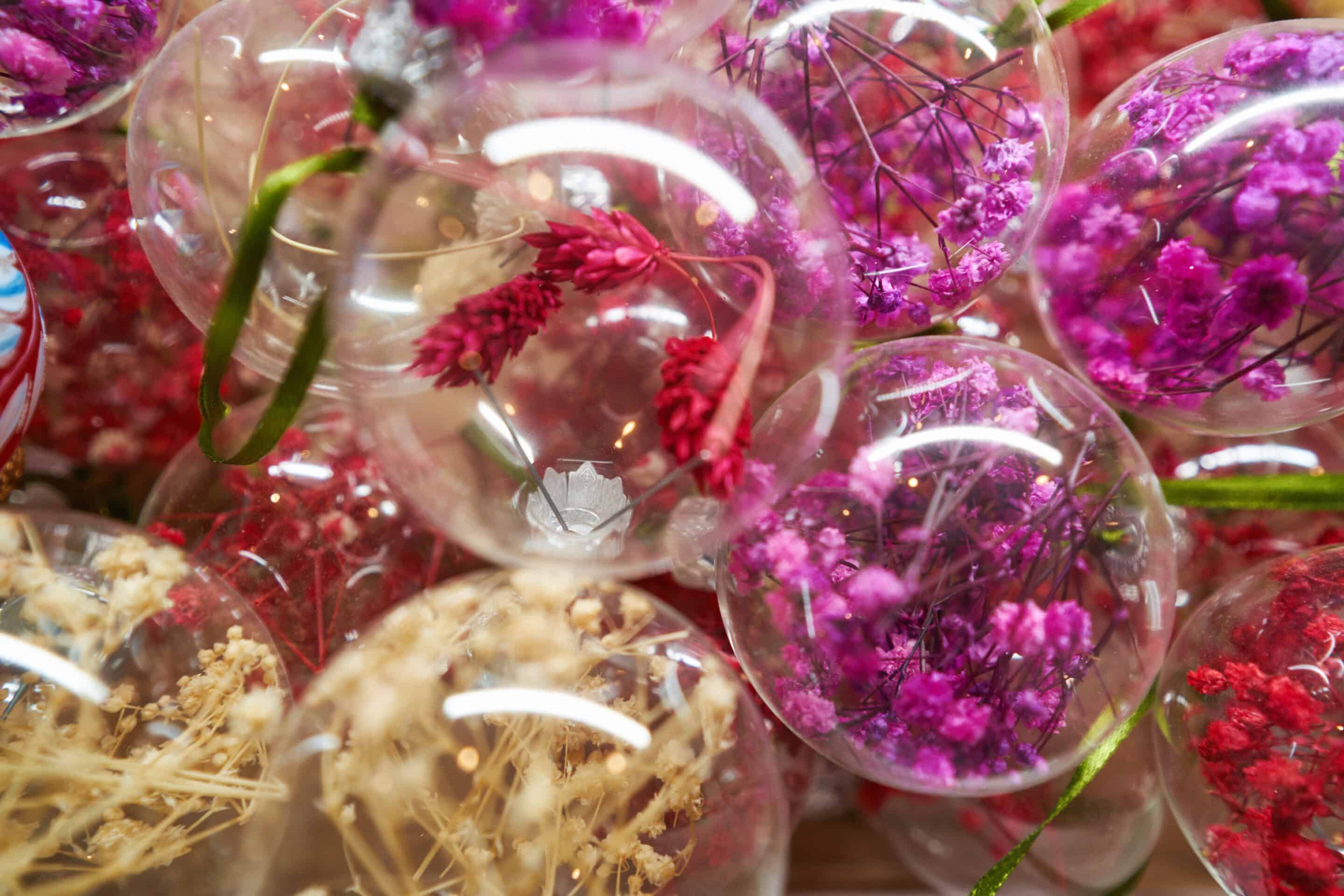 Close up of Christmas decorative balls with colored dried flowers
