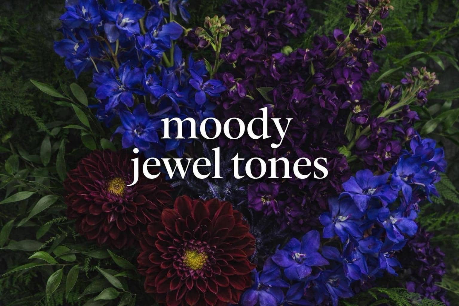 Sunflowers, yellow tulips, orange ranunculus, and lime green hypericum berries