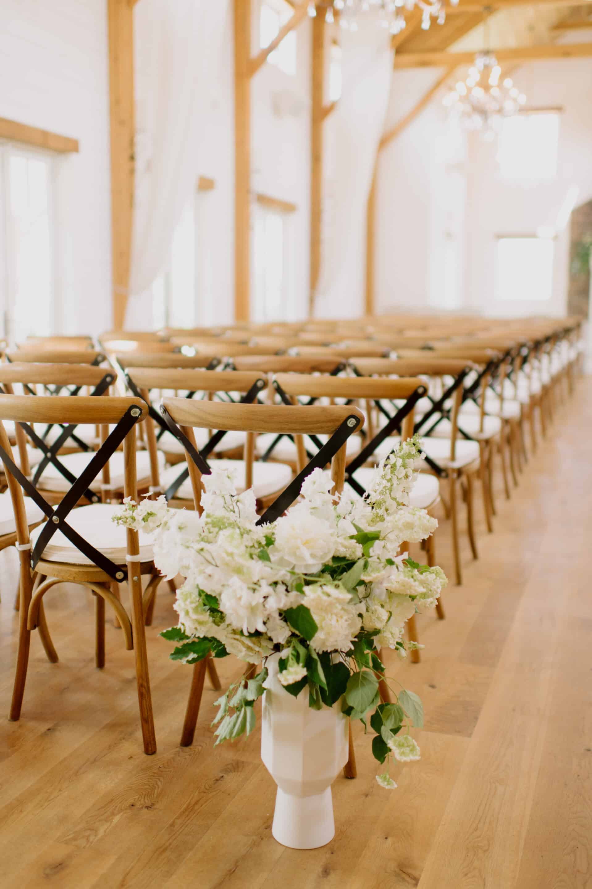 small arrangements at the start of the aisle make a statement and can be repurposed.
